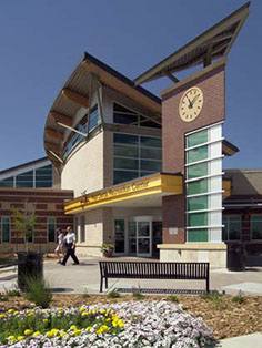 Photo for Community Center - tall clock tower and garden spaces outside entrance